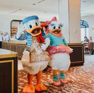 Donald and Daisy Duck at Topolino's Terrace Character Dining Breakfast at Disney's Riviera Resort. One of the things you may not have thought about when planning a trip to Walt Disney World, booking advanced dining reservations.